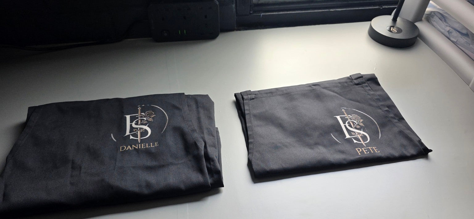 Pete and Danielle's personalised Echo & Sin aprons